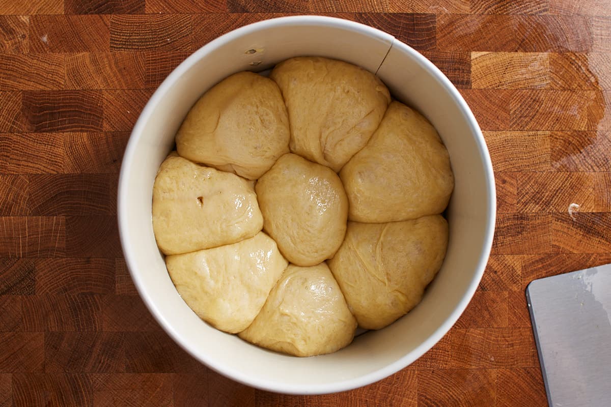 Balls of dough arranged in a round pan
