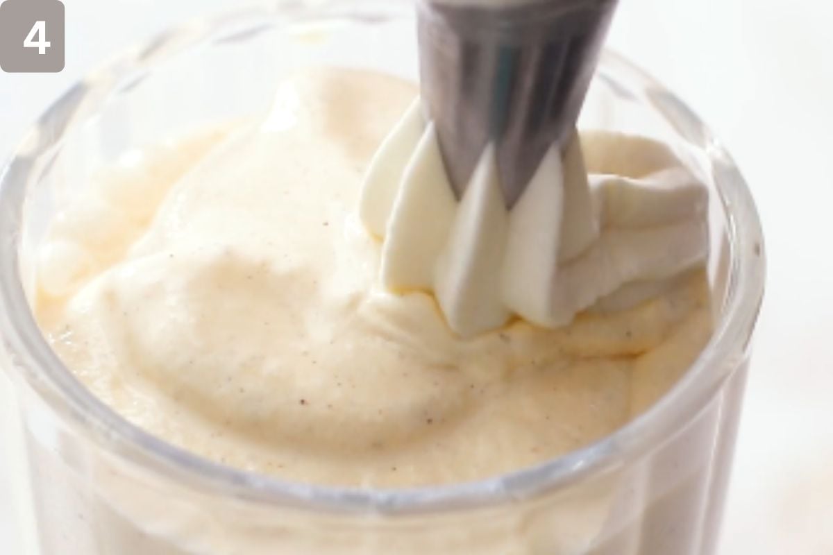 A dollop of whipped cream added on the top