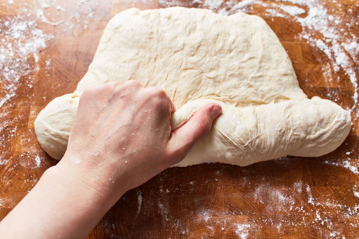 Rolling up the deflated dough