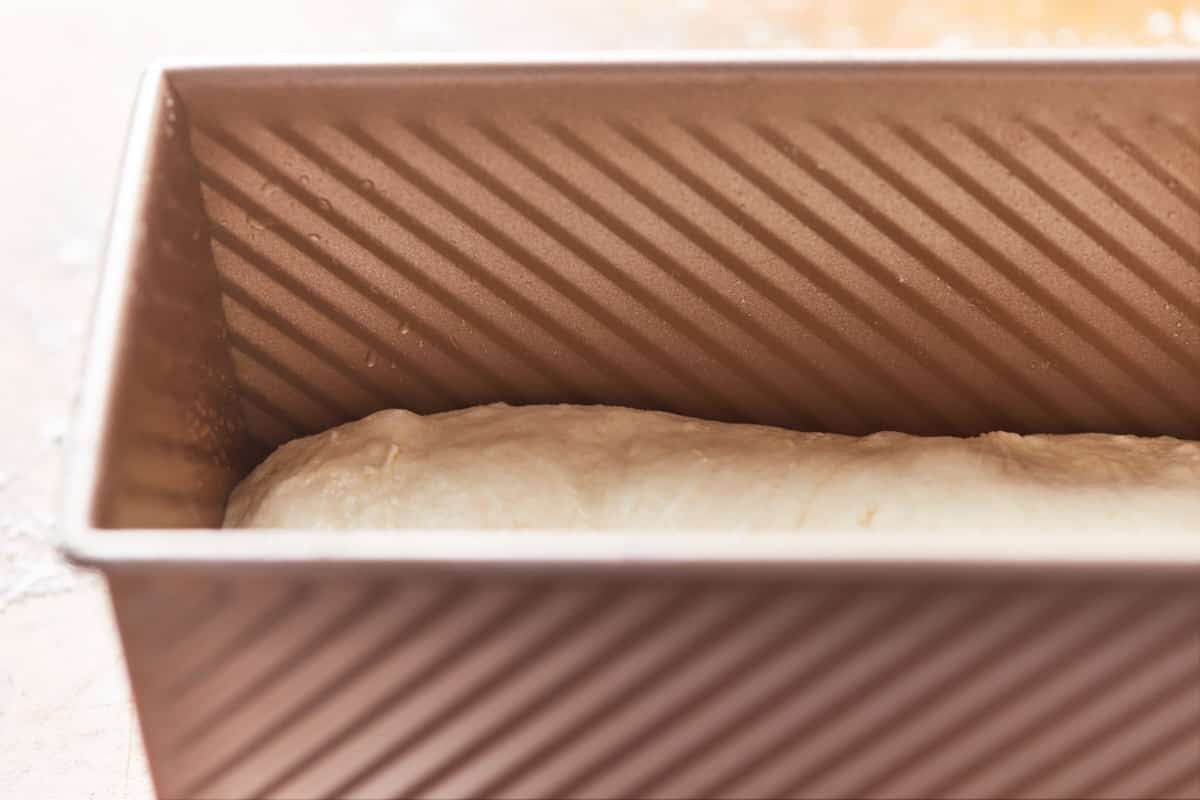 Shaped dough in a loaf pan