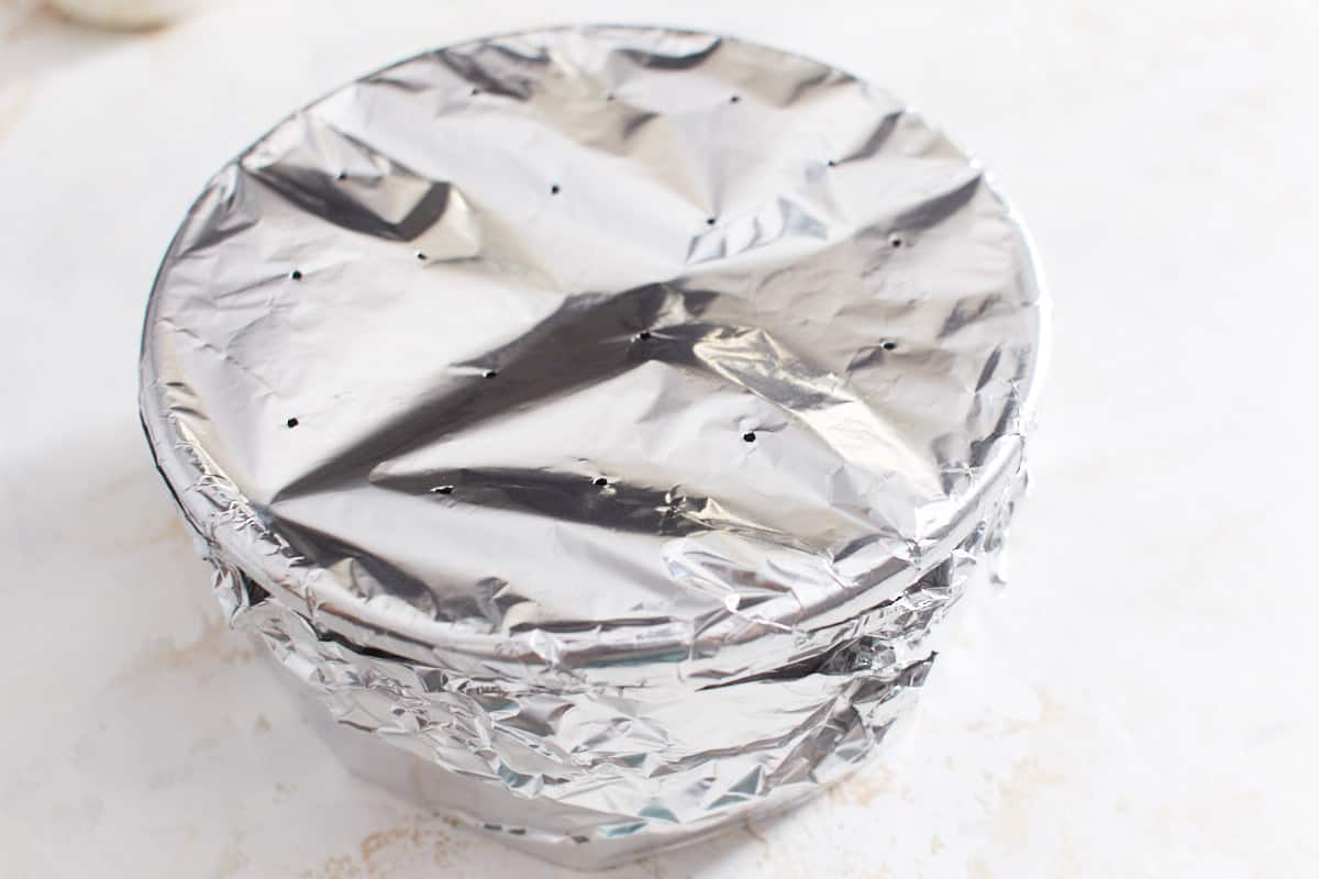 Cake pan wrapped in aluminium foil