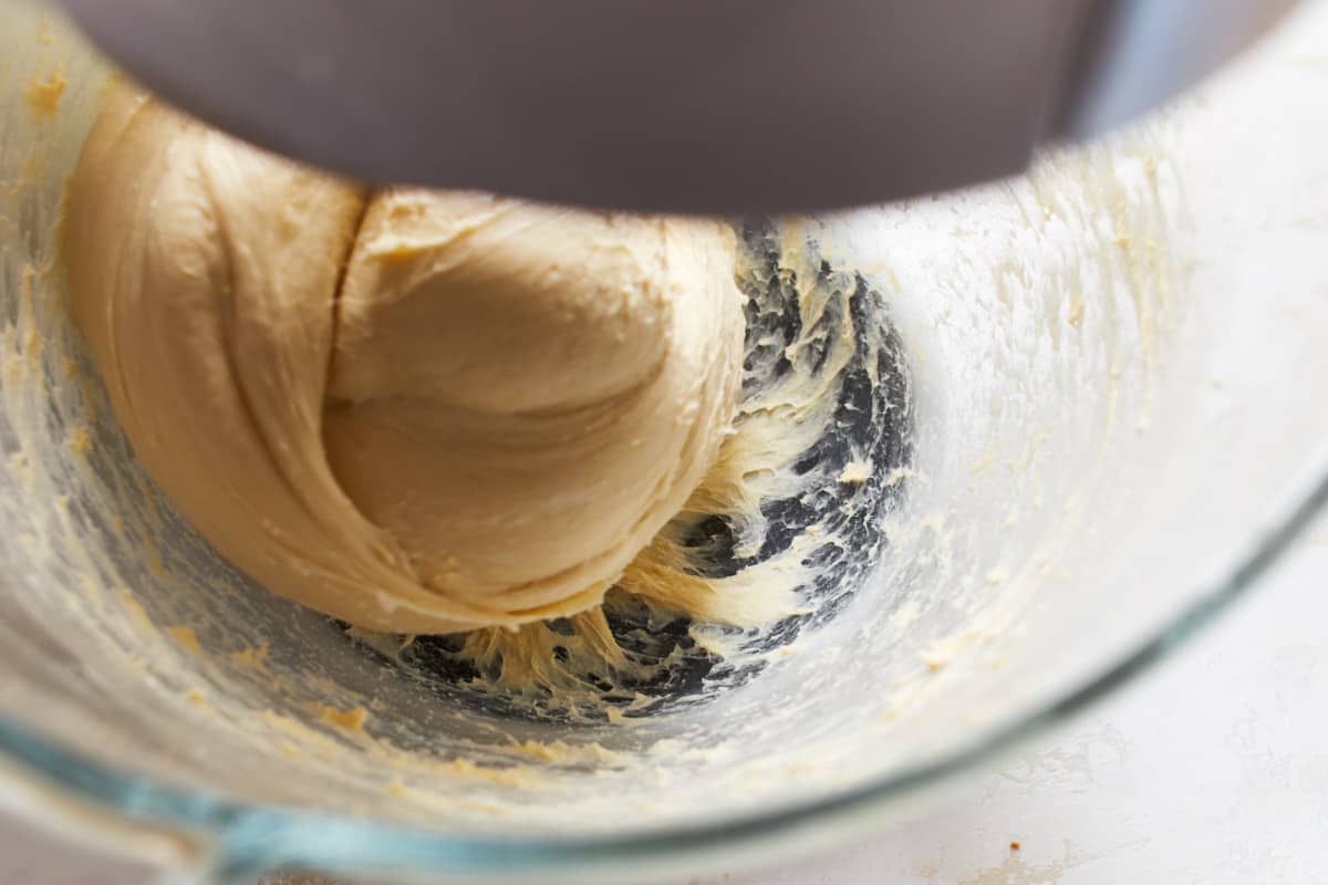 Kneading dough in a bowl of a stand mixer