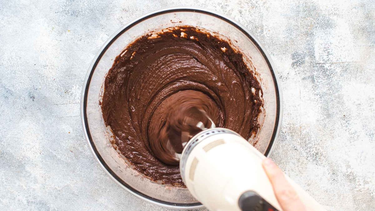 Mixing chocolate batter in a large bowl