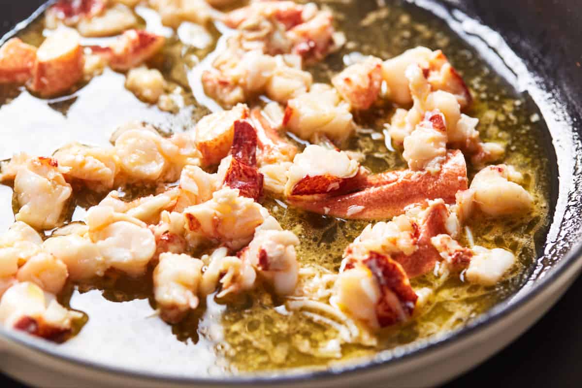 Lobster meat cooking in garlic butter