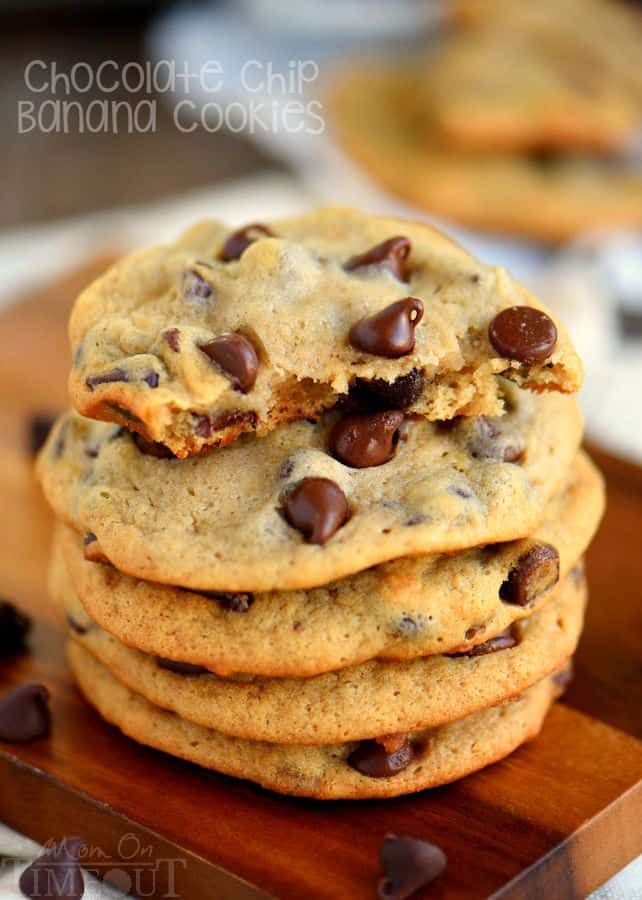 A stack of cookies with one being half eaten