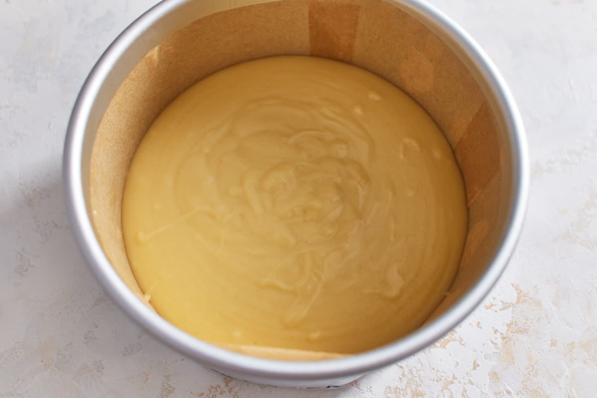 Unbaked cake batter in a cake pan