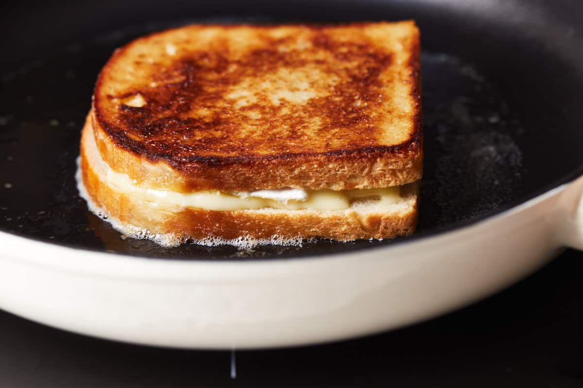 Grilled cheese sandwich in a cast iron pan