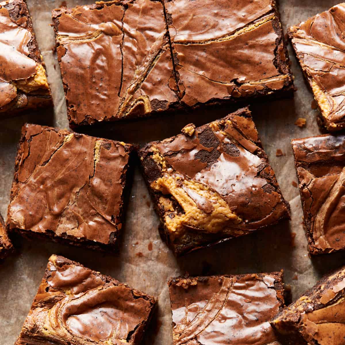 Eight brownies on parchment paper