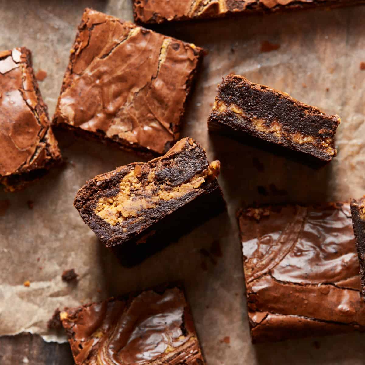 Slices of peanut butter brownies on parchment paper