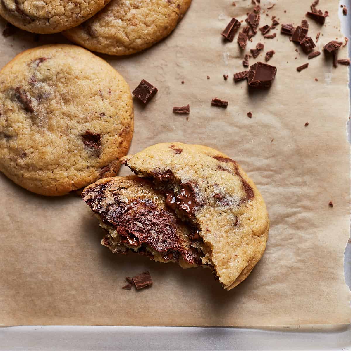 Cookie broken in half on a baking sheet