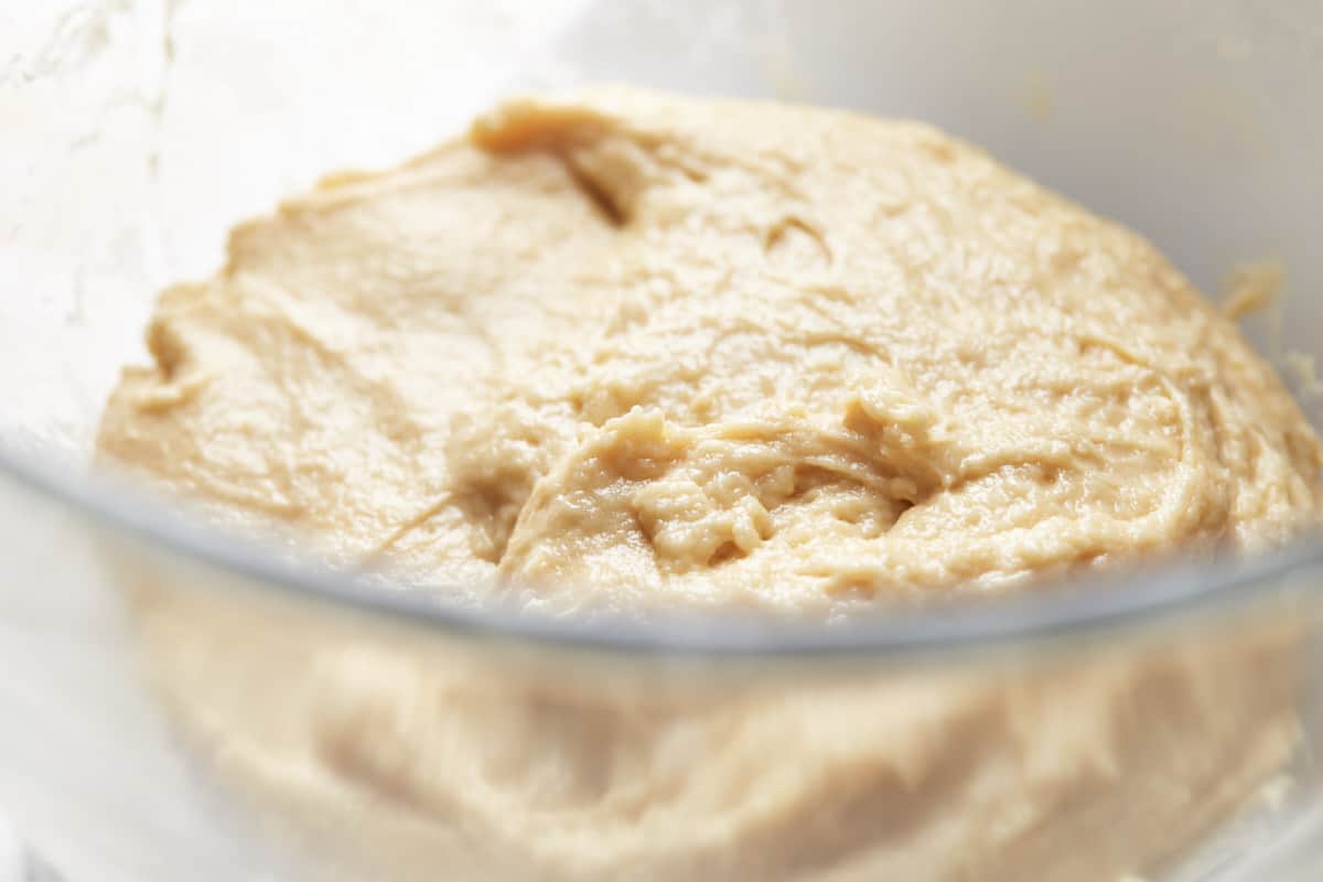 Mixed bread dough in a glass bowl
