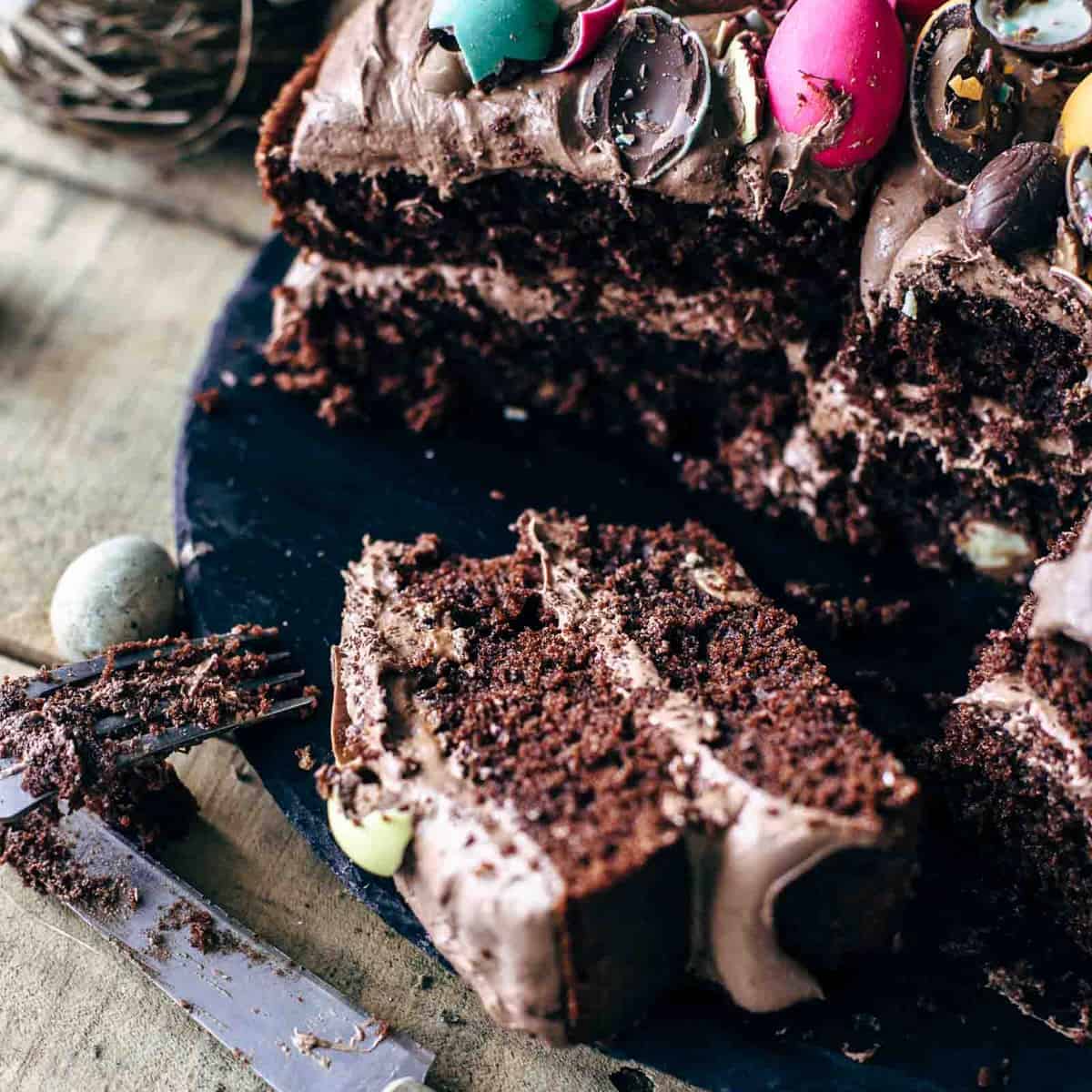 Slices of decorated chocolate easter cake on a table