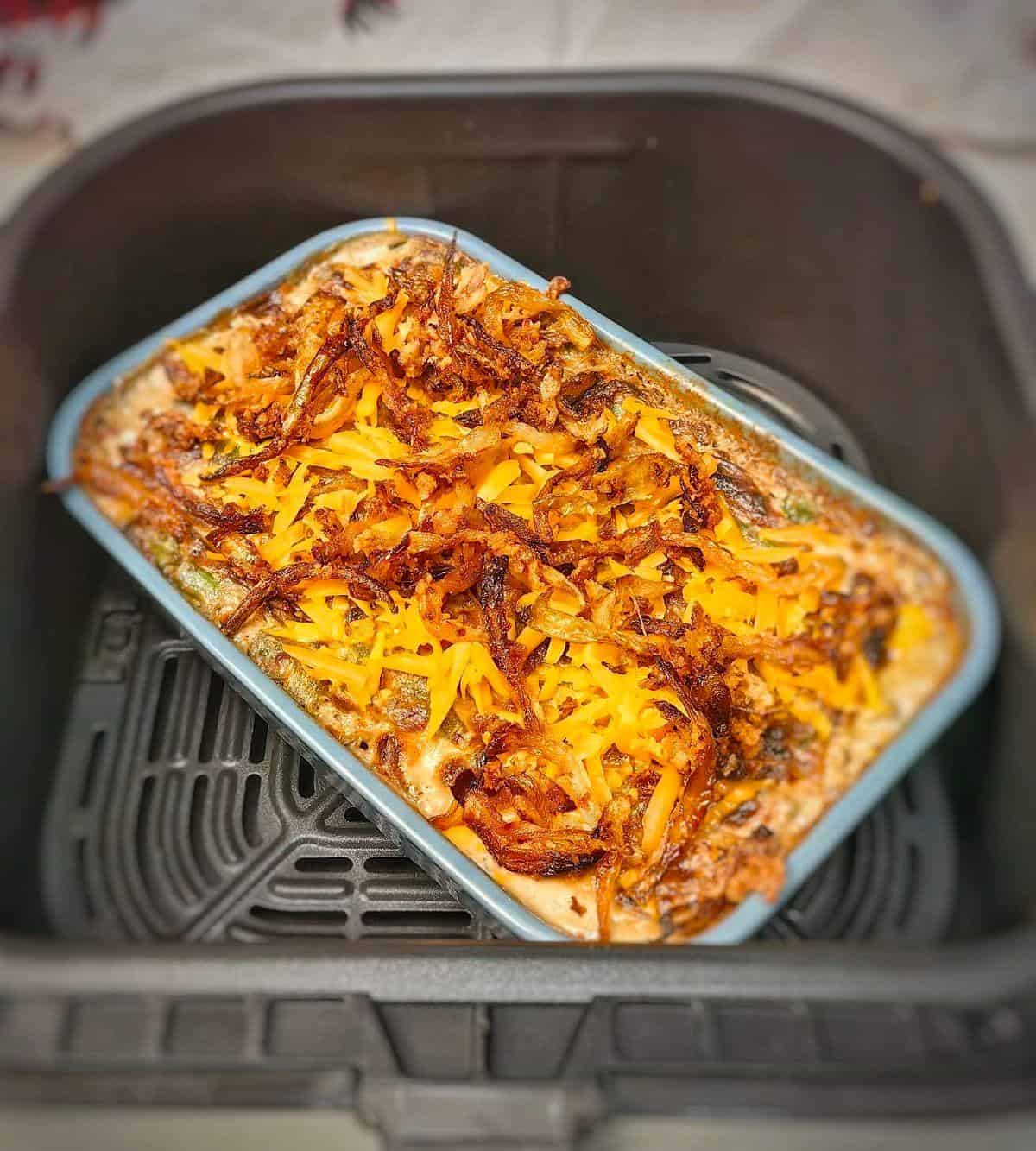 casserole with fried onions in air fryer basket