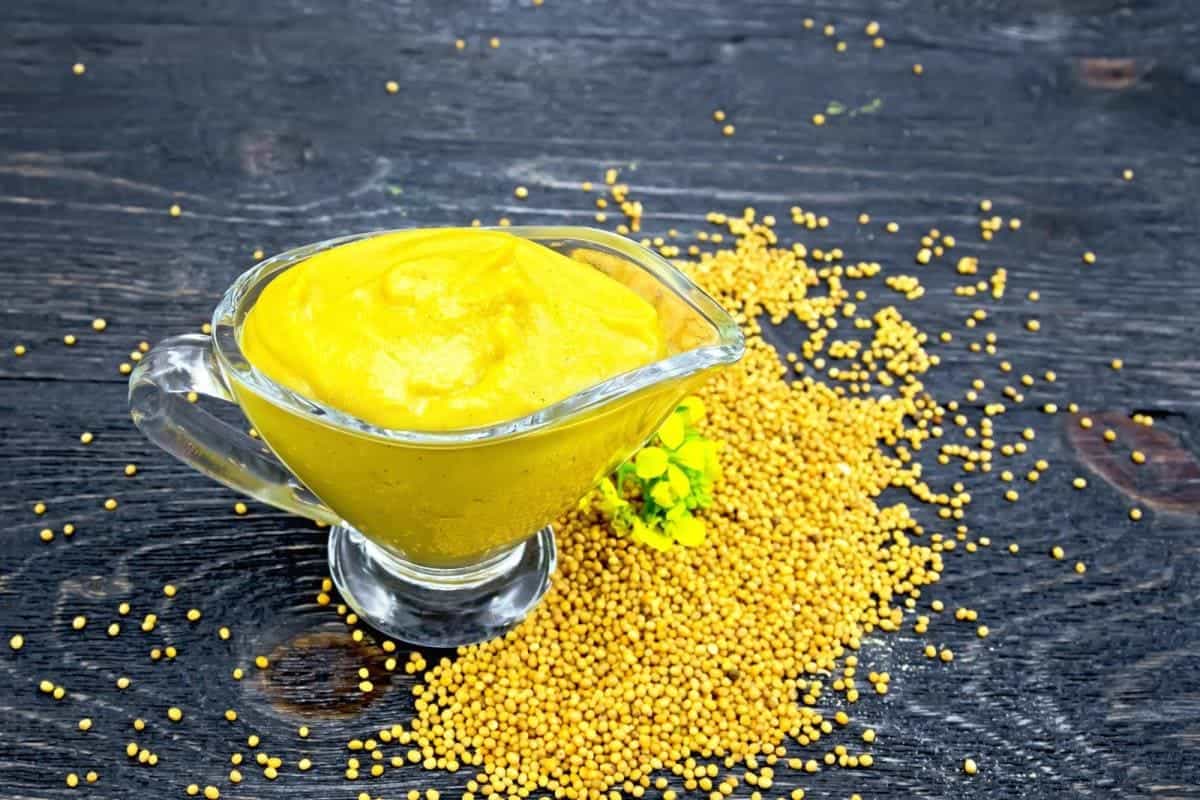 mustard sauce, seeds and flowers of mustard