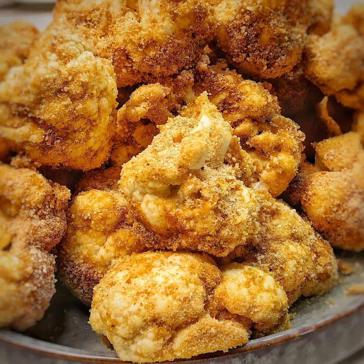 dip each cauliflower floret into egg mixture and coat with breadcrumbs