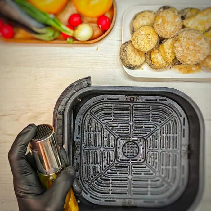 spray the air fryer basket with cooking spray