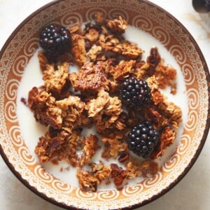 air fryer granola with milk in a bowl