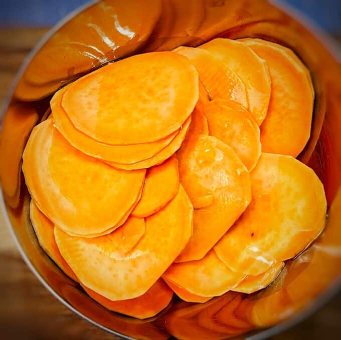 place the sweet potato slices in a large bowl