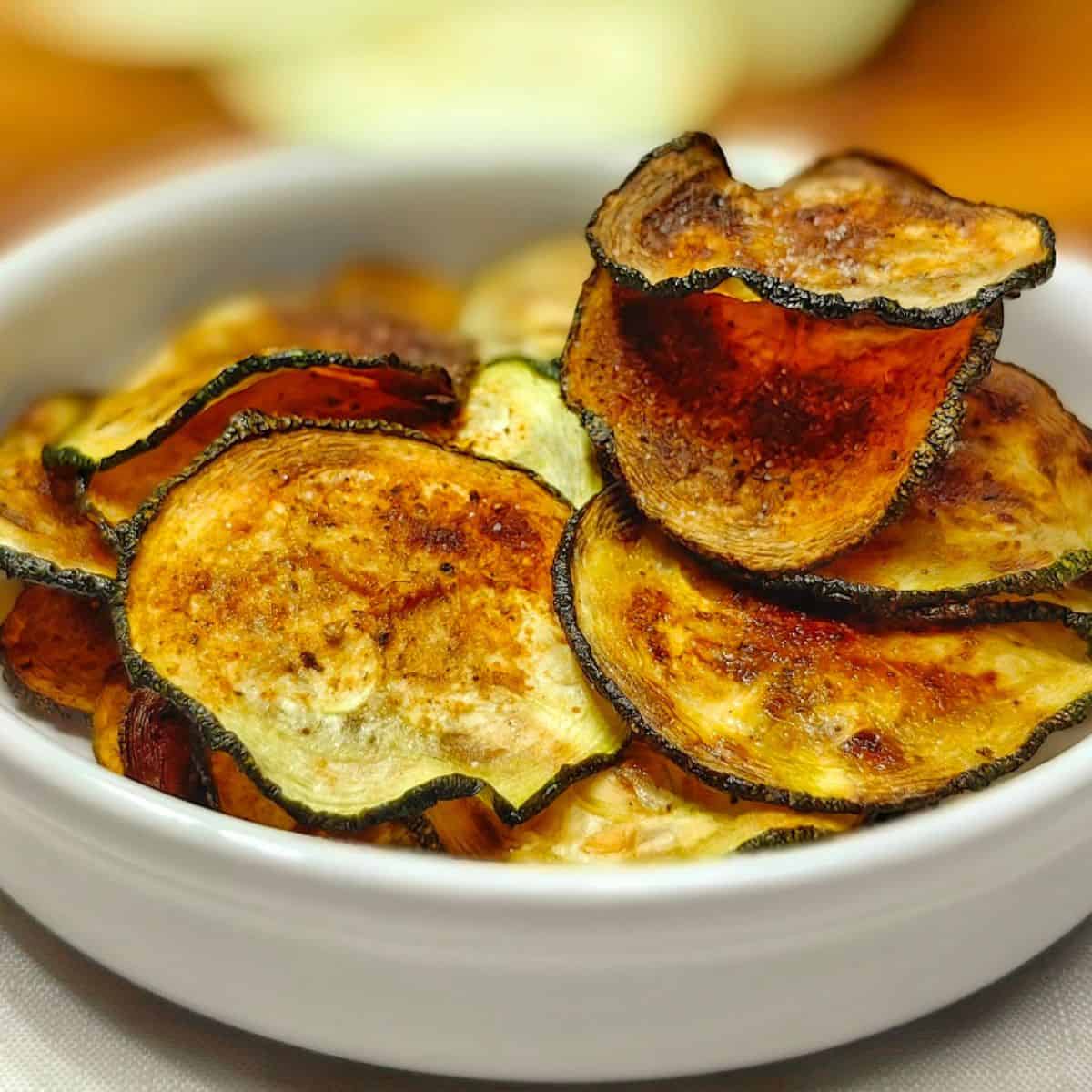 Air fryer Zucchini chips in a white dish