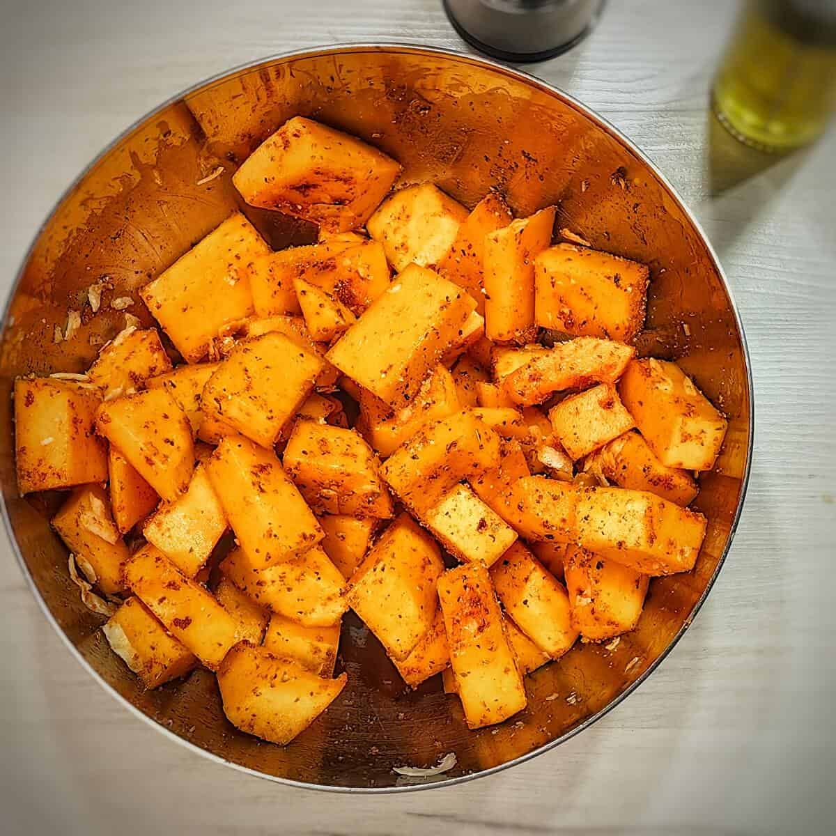 mix oil and seasonings and coat pumpkin slices