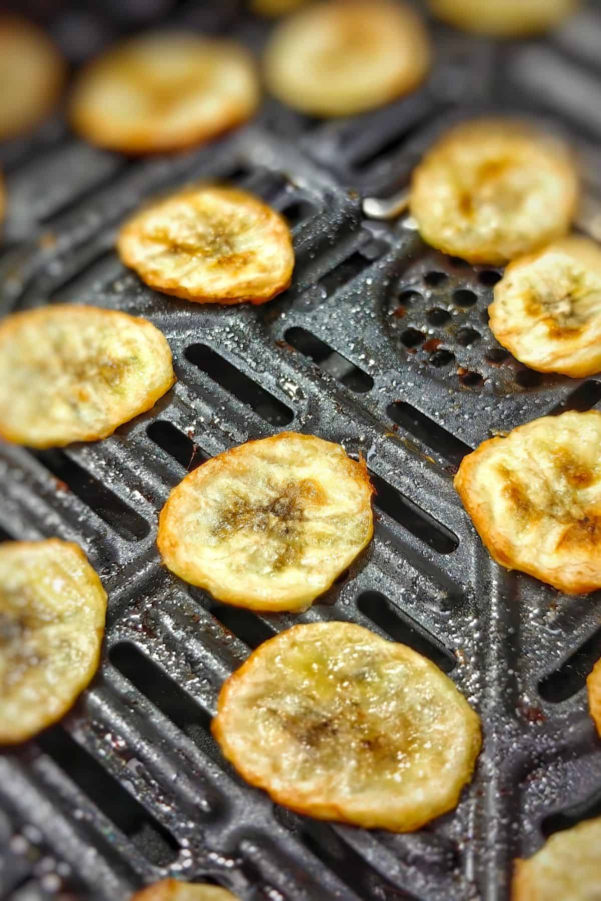 Banana slices being air fried