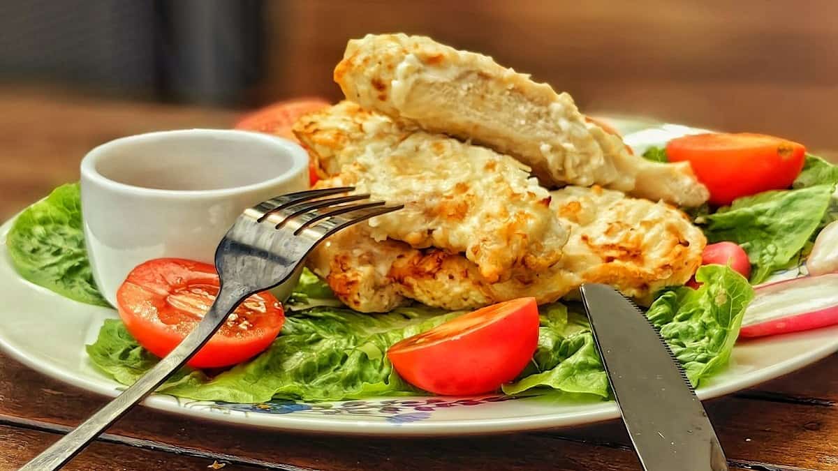 air fried chicken breast with fork and knife