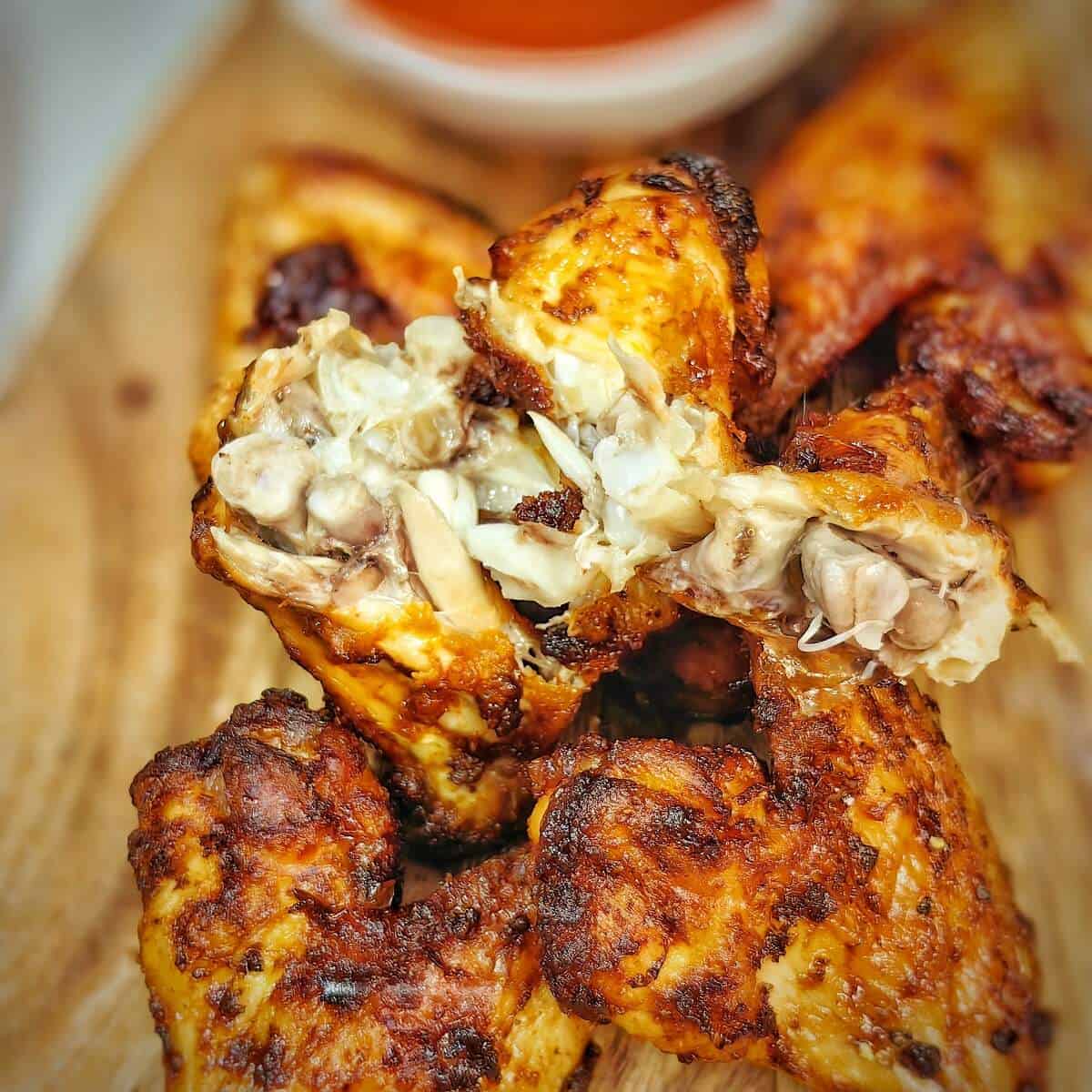 cooked air fryer chicken wings on a serving plate