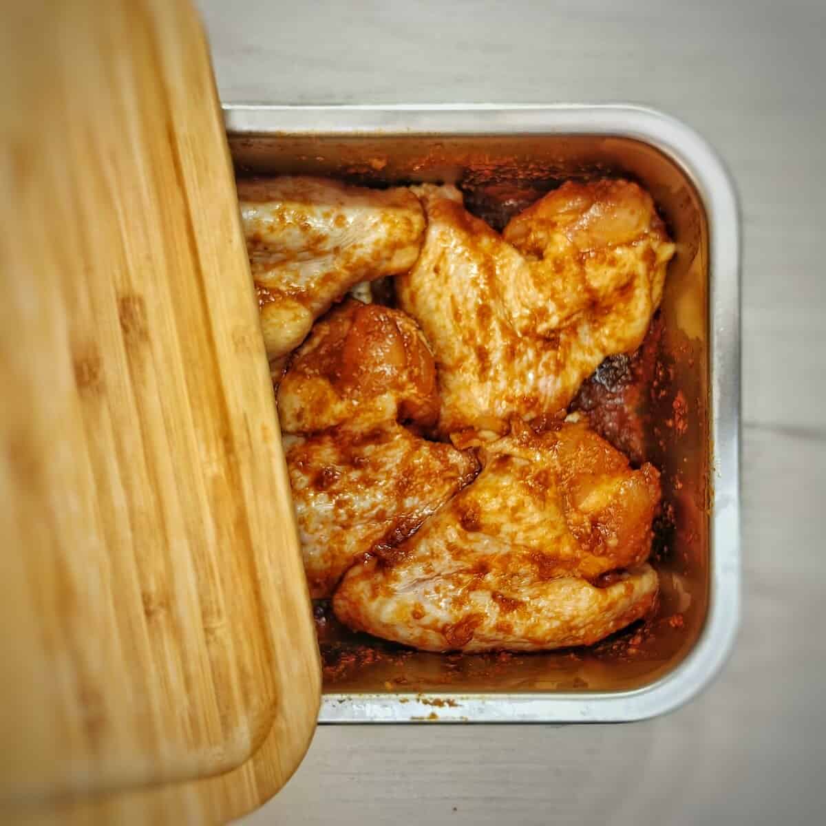 marinated chicken wings in container