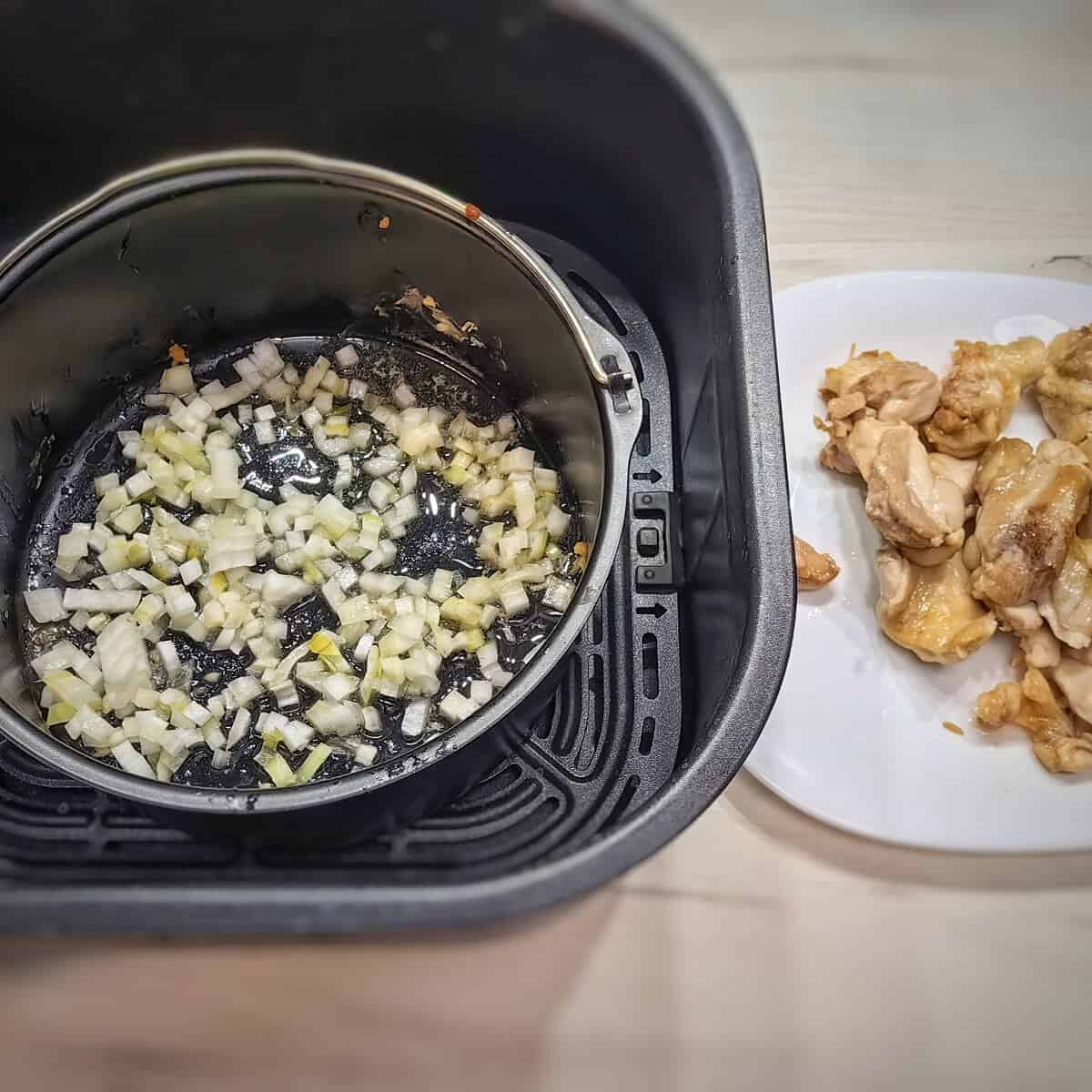 finely chopped onions in the air fryer container