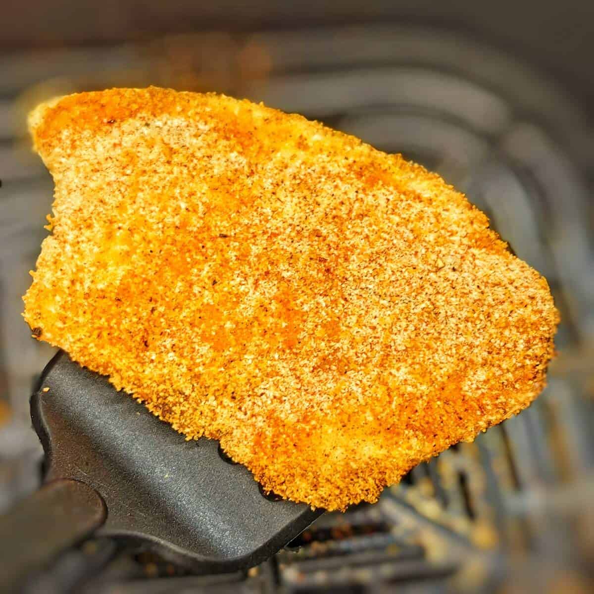 air-fried tilapia on a spatula