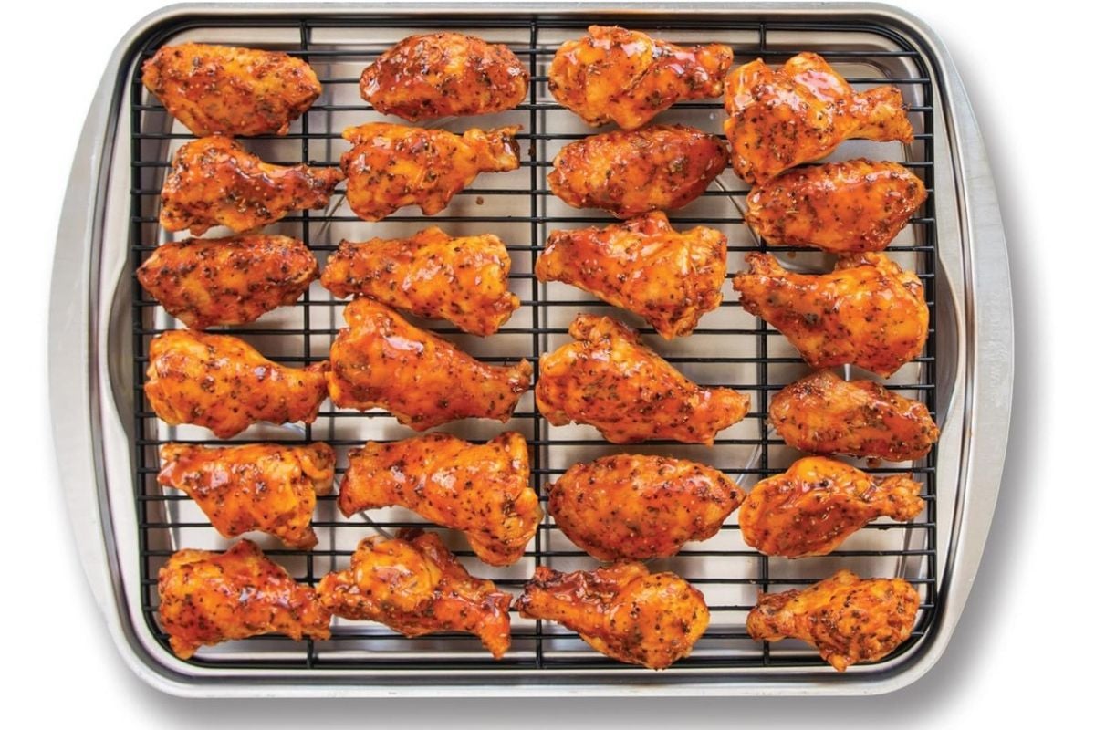 Nordic Ware Oven Crisp Baking Tray with chicken pieces