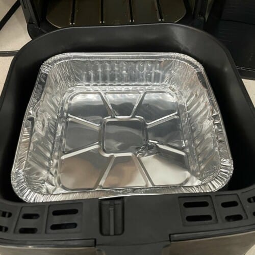 aluminum pan inside air fryer basket