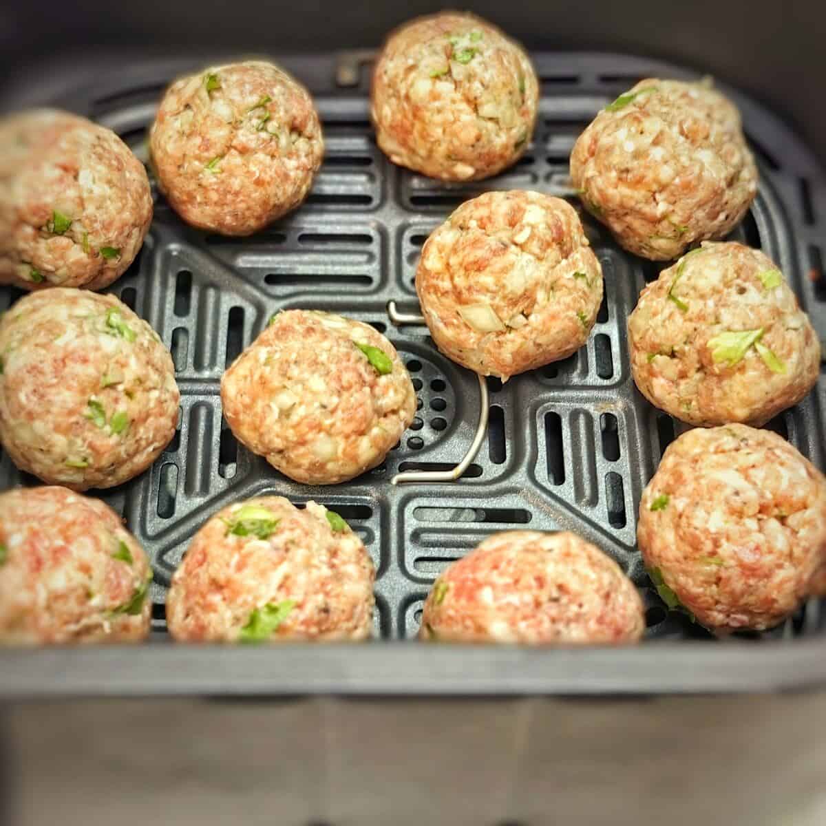 meatballs inside the air fryer basket