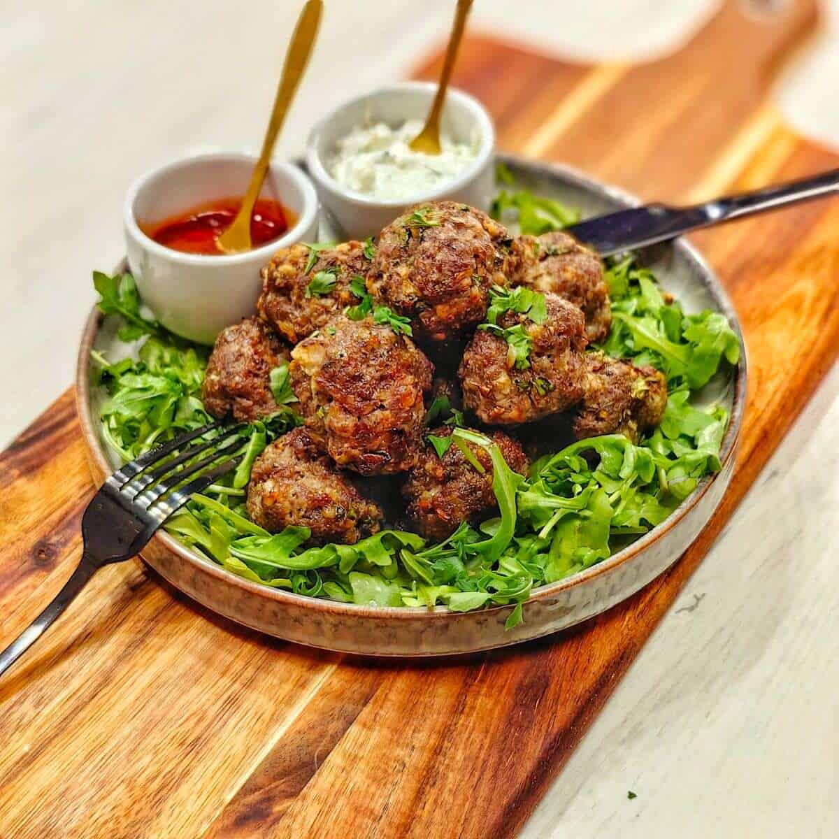 air-fried meatballs with greens and sauces