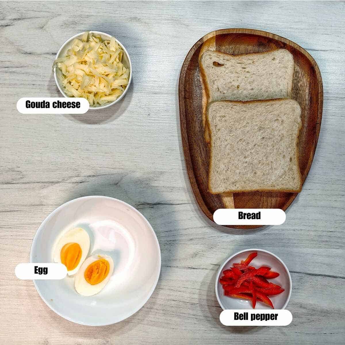 flat lay shot of air fryer breakfast boiled egg toast ingredients