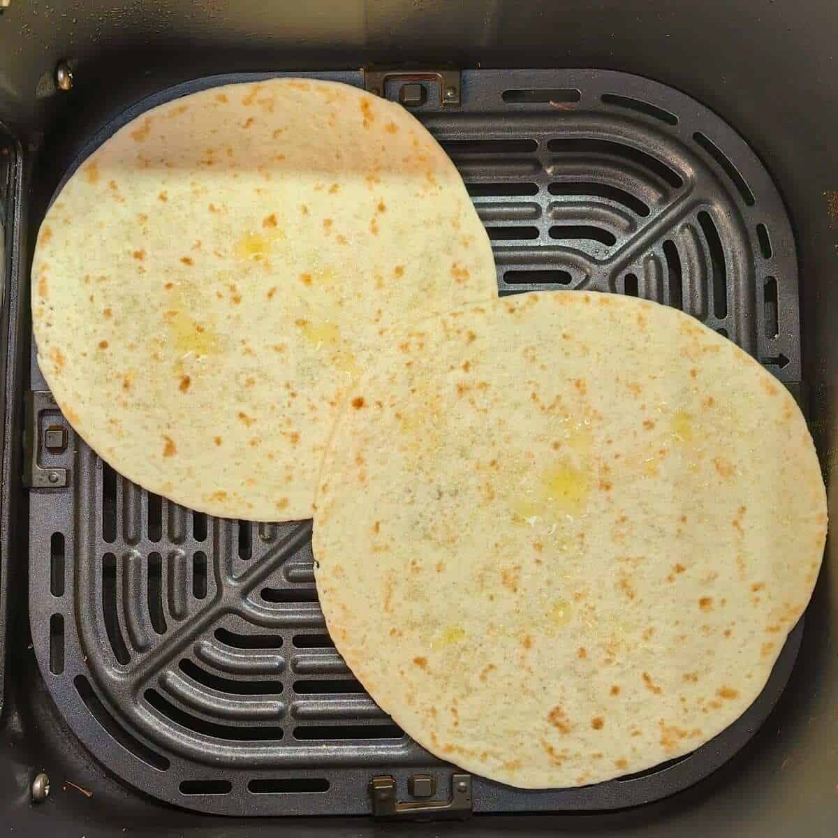 2 tortillas in air fryer basket