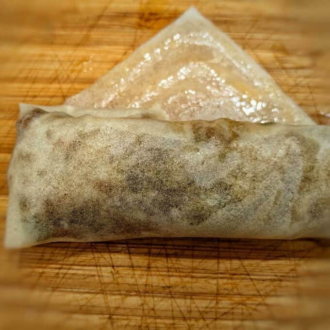 rolling egg roll wrapper with filling