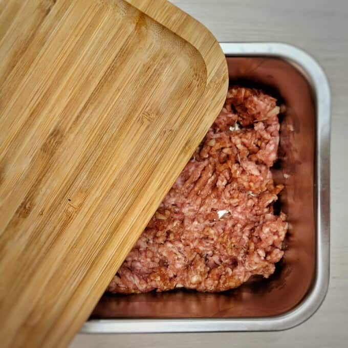 ground pork in a metal container