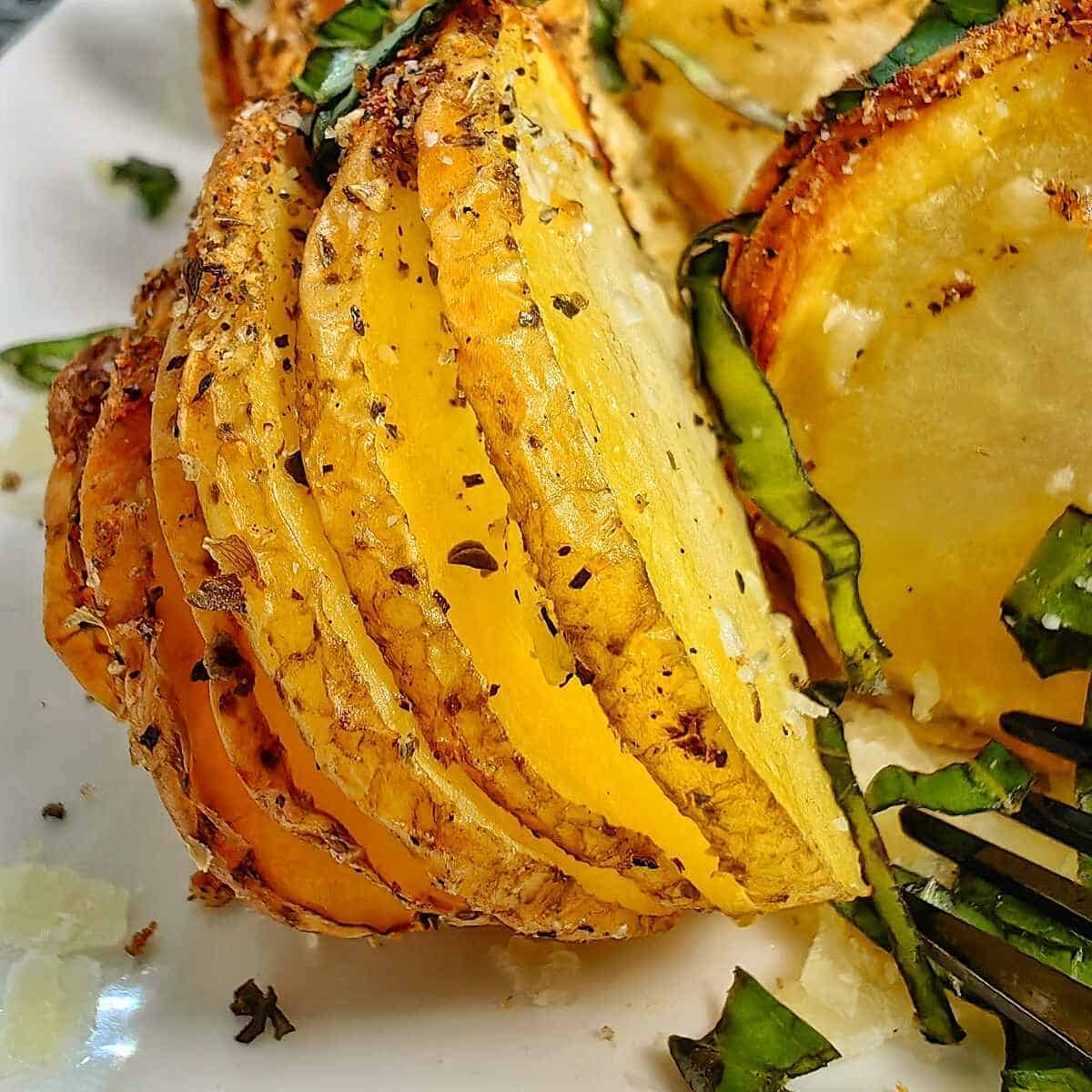 air fryer hasselback potatoes with garnish of chopped parsley