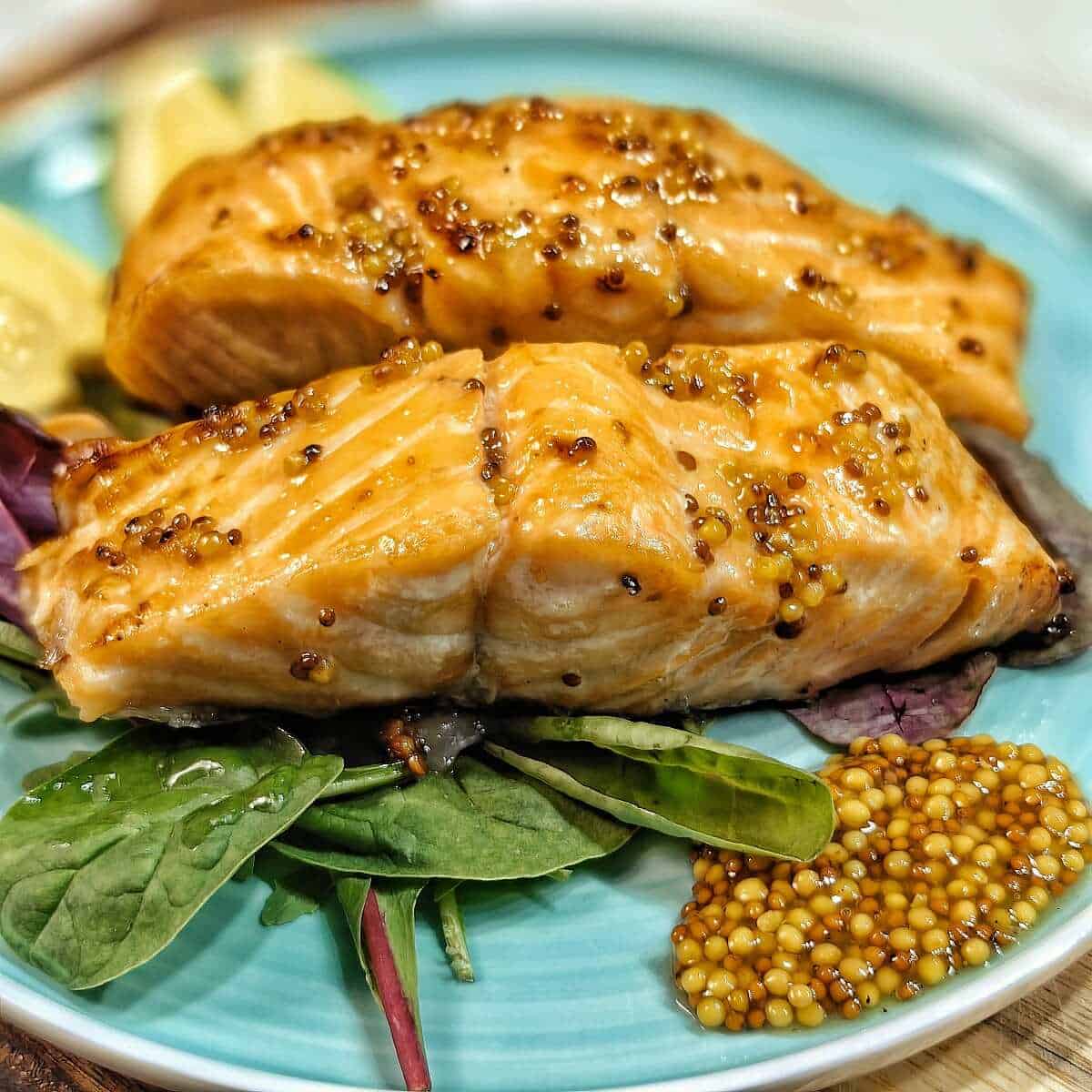 air fried honey mustard salmon with mustard seeds and greens