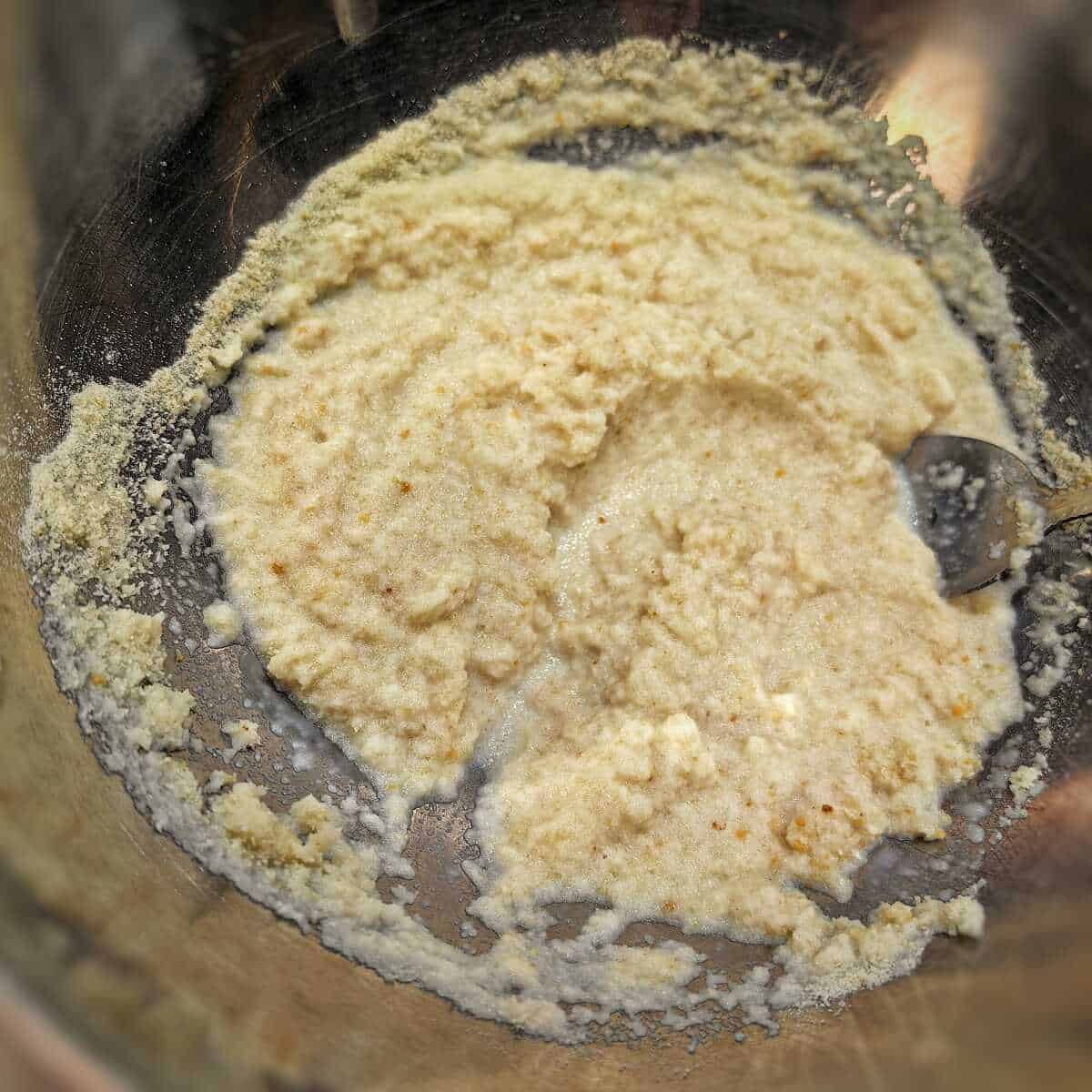 breadcrumbs and milk mixture in a metal bowl