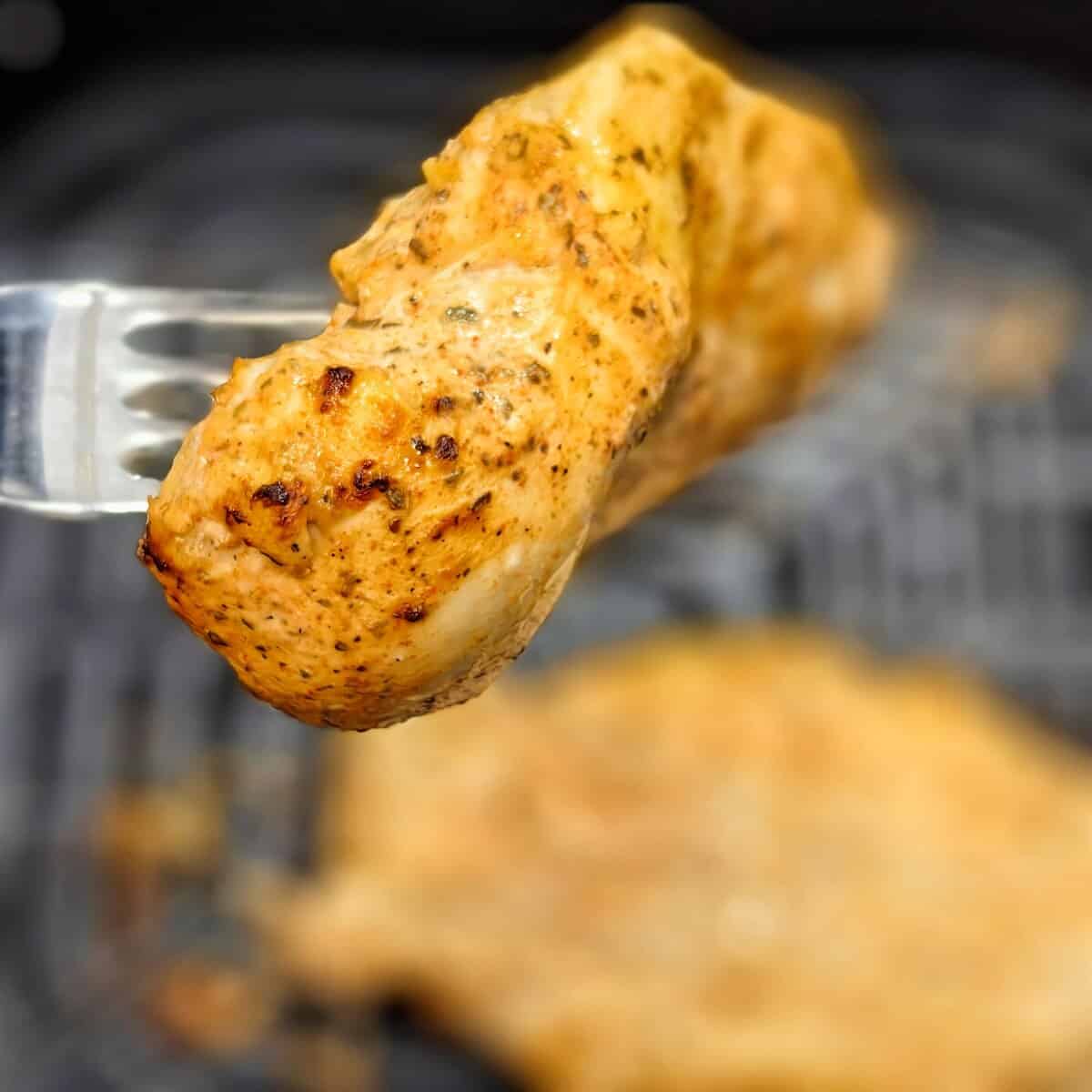 air fried chicken breast with a fork