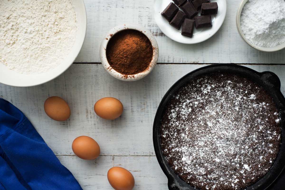 brownies in cast iron with ingredients on the table