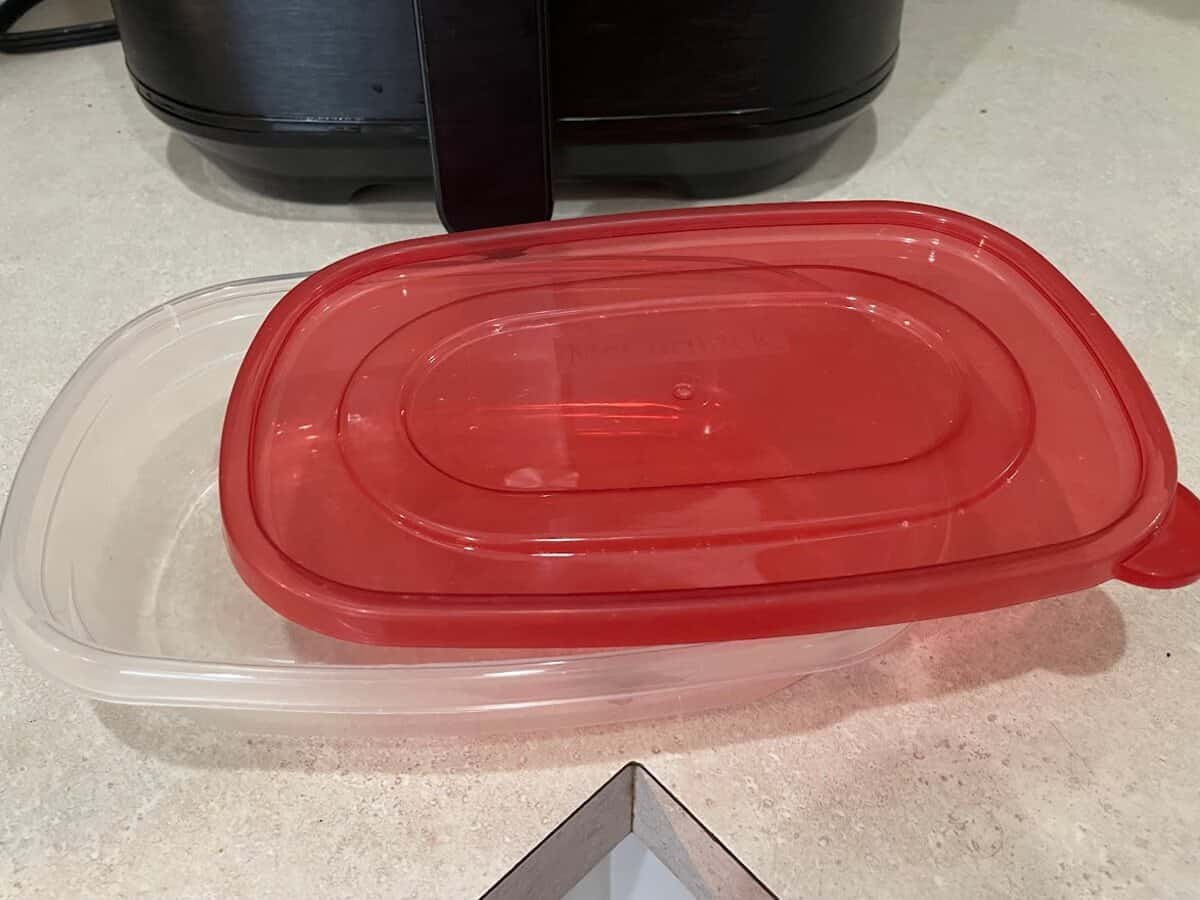 plastic container in front of air fryer