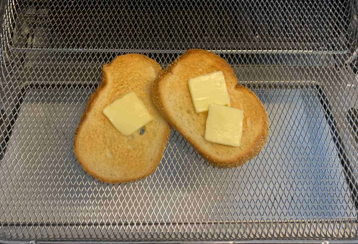 toasted sliced white bread with slices of butter