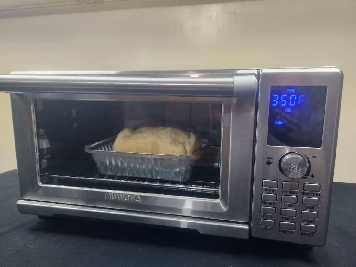 bread in an aluminum pan inside air fryer