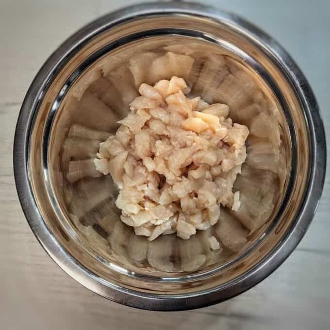 diced chicken in metal mixing bowl