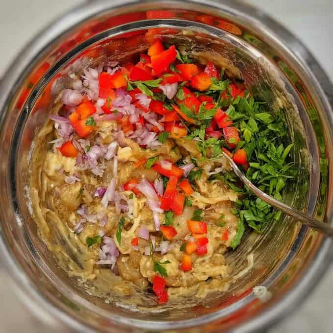 diced chicken and chopped vegetables in metal mixing bowl