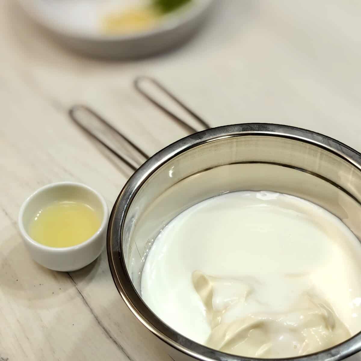 mayonnaise in a mixing bowl and lemon juice