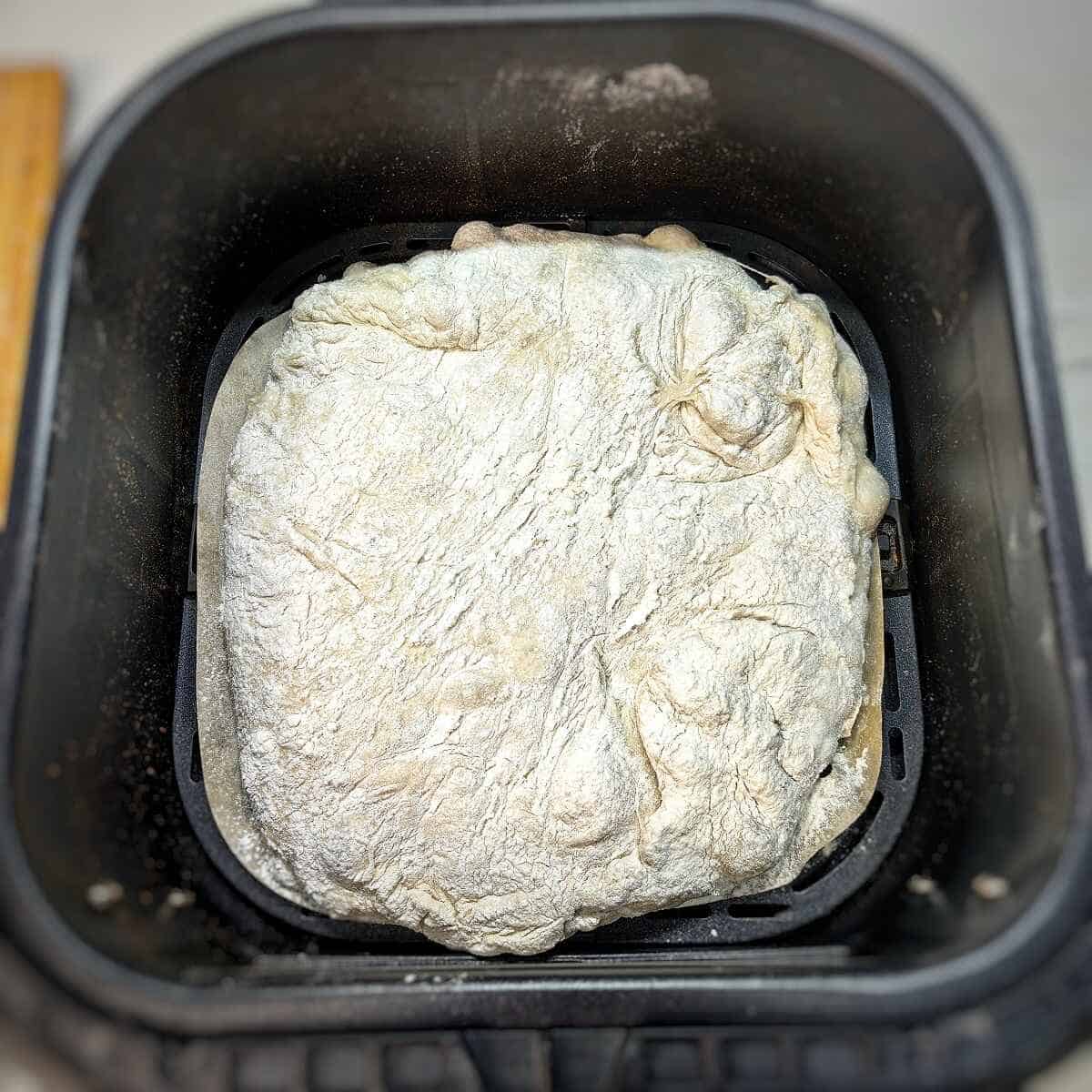 ciabatta dough insider air fryer basket with parchment liner